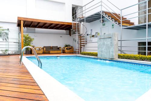 a swimming pool in the middle of a building at Jose Antonio Executive in Lima