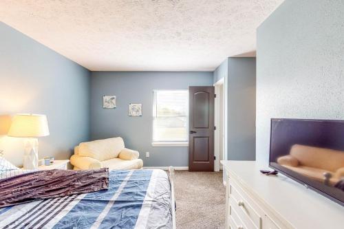 a bedroom with a bed and a chair at Indy Home w/ Dog-Friendly Yard! 9 Mi to Dtwn in Spring Hollow
