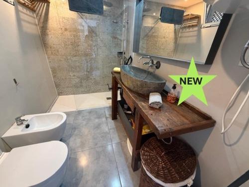 a bathroom with a sink and a toilet at Apartment Royal Sunset Loggia in Palm-Mar