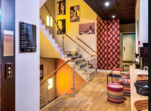 a staircase in a room with a stair case at Boutique Hotel Lumiere in Eindhoven