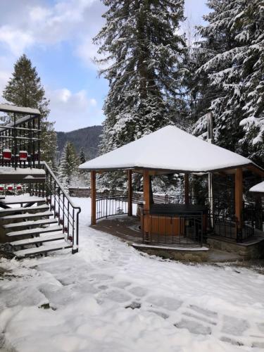 a gazebo with snow on top of it at Guta Weekend in Guta