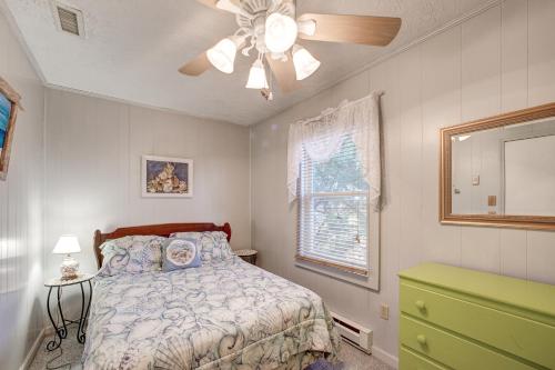 a bedroom with a bed and a ceiling fan at AV67 Diamond Shoals 67 in Avon