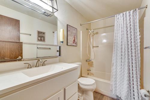 a white bathroom with a sink and a toilet at 3 Mi to Windham Mountain: Pet-Friendly Apt w/ Yard in Hensonville