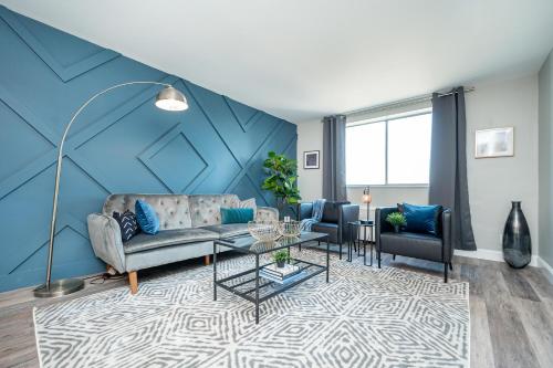 a living room with a couch and a table at Atlanta Downtown! 3 Unique Apartments Available! Onsite Parking in Atlanta