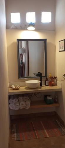 a bathroom with a sink and a mirror at mirapampa in Maimará
