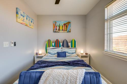 a bedroom with a bed with surfboards on the wall at Surfboard-Themed Huddleston Studio w/ Beach Access in Huddleston