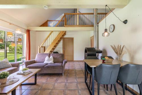 a living room with a couch and a table at Ferienhaus 4 in Fehmarn