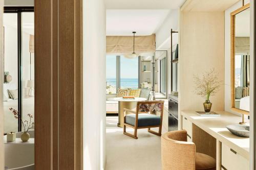 a living room with a view of the ocean at Hotel Arts Barcelona in Barcelona