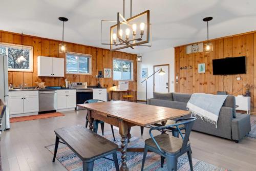 a kitchen and living room with a table and a couch at Central Bench Garden Guest House in Boise