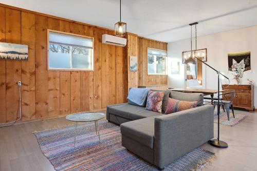 a living room with a couch and a table at Central Bench Garden Guest House in Boise