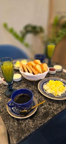 a table with plates of food on a table at Hotel Boutique Ubuntu in Buenos Aires