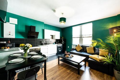 a living room with a couch and a table at Spacious 4-Bed Apartment · Sleeps 6 · City Centre in Nottingham