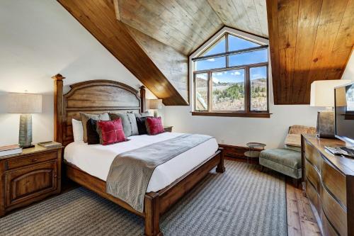 a bedroom with a large bed and a window at The Pines Lodge, a RockResort, by Vail Resorts in Beaver Creek