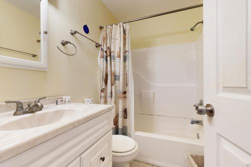 a bathroom with a sink and a toilet and a shower at AV054 Blue Dolphin in Avon