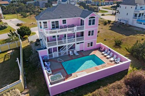 an overhead view of a pink house with a swimming pool at AV13 Time Away in Avon