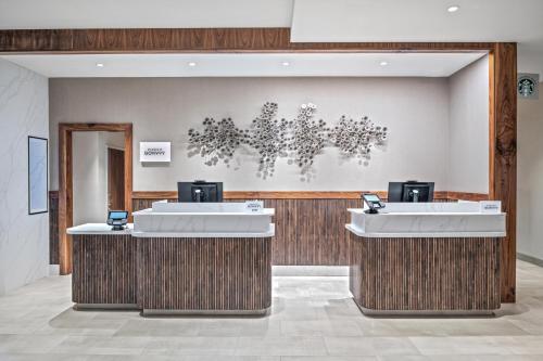 a lobby with two sinks in a room at Courtyard by Marriott Woodland in Woodland