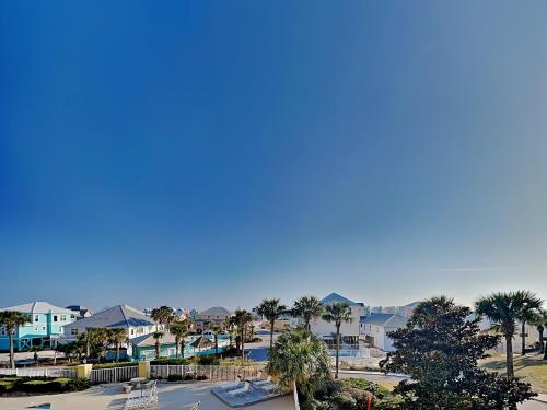 a view of a town with palm trees and houses at The Indies #209 in Fort Morgan