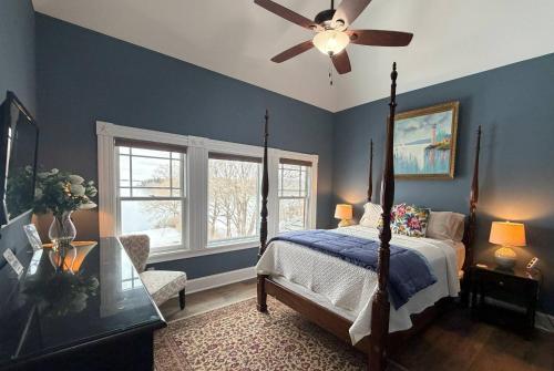 a bedroom with a bed and a ceiling fan at Saltair Inn Waterfront B&B in Bar Harbor