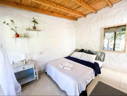 Llit o llits en una habitació de Los Lagos de Jasú