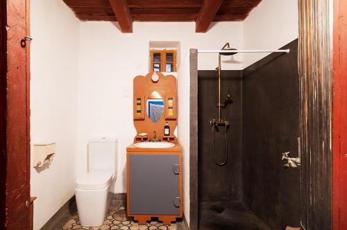a small bathroom with a sink and a toilet at NohaTerény in Terény