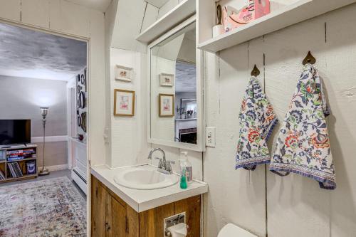 a bathroom with a sink and a mirror at Historic 1820s Homestead on Battenkill River! in Arlington