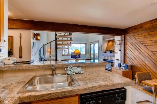 a kitchen with a sink and a counter top at Crested Butte Mountain Resort Properties by Vail Resorts in Crested Butte