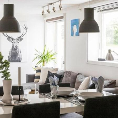 a living room with a couch and a table at Central 4 room apartment in Bergen