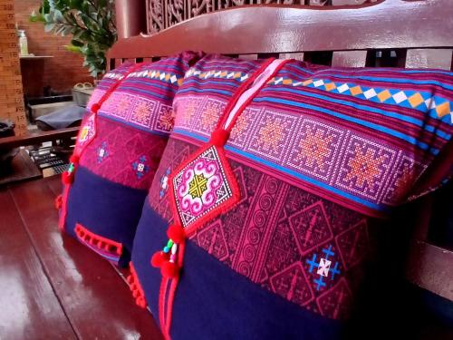 a bag sitting on top of a chair at Baan Cozy Boutique Natural Wellness Chiang Mai in Chiang Mai