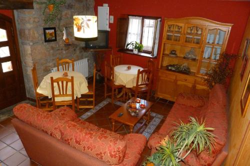 a living room with a couch and a table at Hotel Mestas in Arenas de Cabrales
