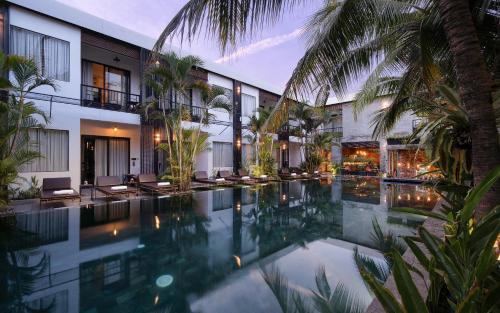 an image of a swimming pool at a resort at Central Corner Suite in Siem Reap
