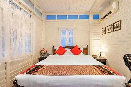 Postel nebo postele na pokoji v ubytování Baankachitpan Bangkok Hotel