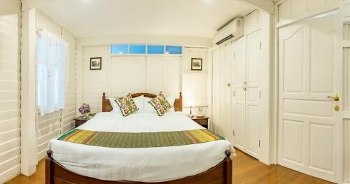 Postel nebo postele na pokoji v ubytování Baankachitpan Bangkok Hotel