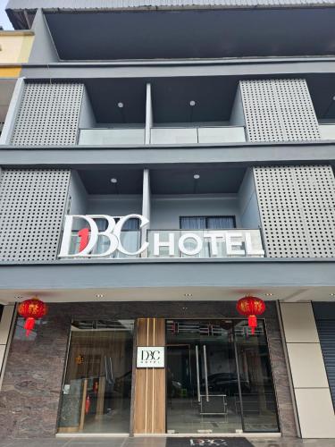 a store front with a sign for a boutique at DBC Hotel in Semporna