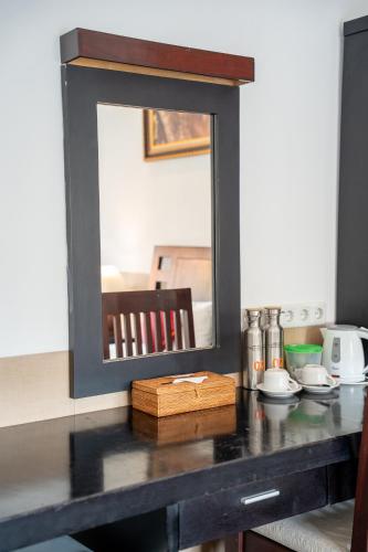 a mirror on a counter in a kitchen at Tulamben Dive Resort in Tulamben