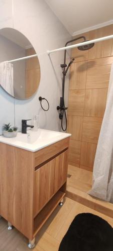 a bathroom with a sink and a mirror at Cabañas Torres del Sol in Vicuña