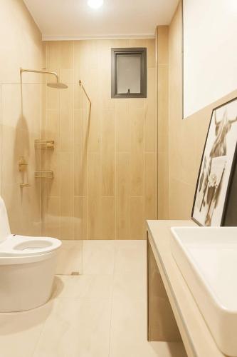 a bathroom with a toilet and a shower and a sink at Villa Narkis in Haad Yao