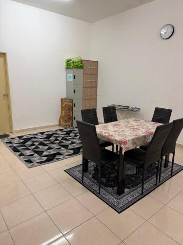 a dining room with a table and chairs at ZARA Homestay in Marang