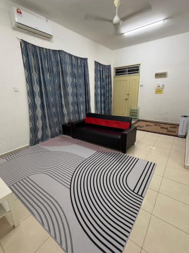a bedroom with a large bed in a room at ZARA Homestay in Marang