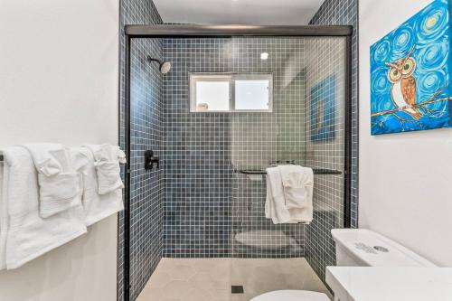 a bathroom with a shower and a toilet at Santorini with Stargazing - Views - Spa - Fire pit in Yucca Valley