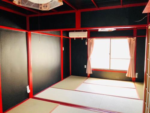 an empty room with red lines on the walls at Yokohama Sakae-chou Ninja House #JA1 in Yokohama