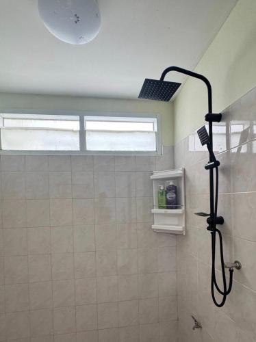 a bathroom with a shower with a shower head at Happy Home Samui near Mae Nam beach on main road in Ban Mae Nam