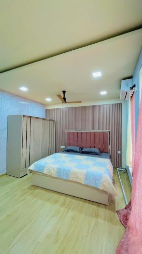 a bedroom with a large bed in a room at Shubh causy 4bhk villa in Lonavala