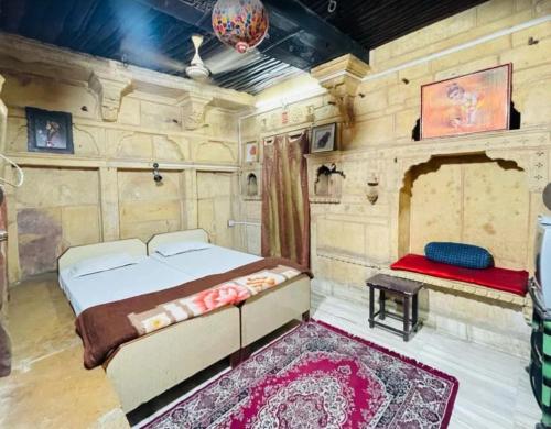 a bedroom with a bed in a room with wooden walls at The Jeet Mahal Hotel in Jaisalmer