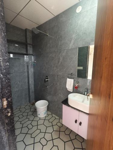 a bathroom with a sink and a toilet and a shower at Hotel Yashoday in Kekri