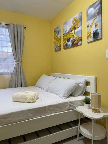 a bedroom with two beds and a window at Casa Solana at Malaybalay VCDU Phase 3 B4 L22 in Malaybalay