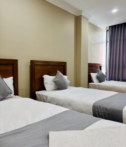 Postel nebo postele na pokoji v ubytování Hotel Gulmohar