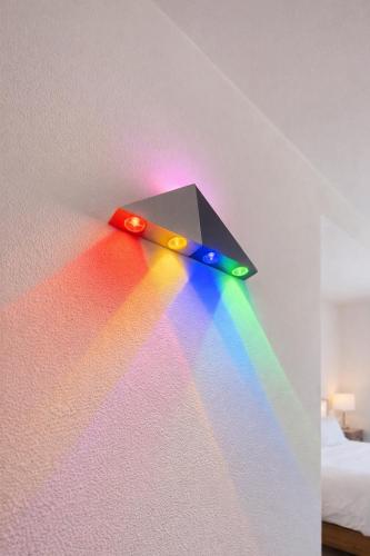 a rainboworescenceorescenceorescenceorescenceorescenceorescenceorescenceorescence of a wall with a rainbow at Modern Double Room in Peaceful Pembroke just Minutes away from St Julians in Pembroke