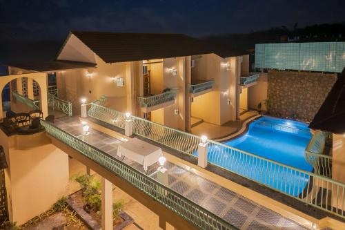 an aerial view of a house with a swimming pool at The Bagh Villa Pench By Ficusroots Experience in Khawāsa