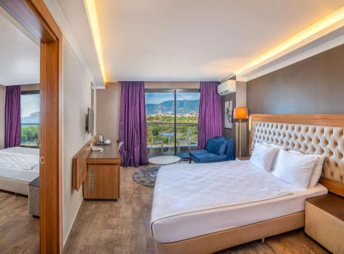 Llit o llits en una habitació de Michell Hotel & Spa - Adult Only - Ultra All Inclusive