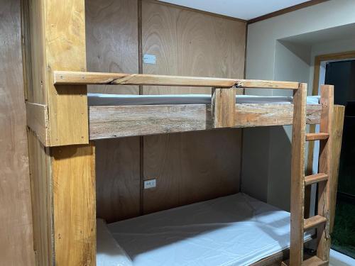 a couple of bunk beds in a room at Leigh Backpackers in Leigh
